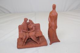 An Eric Griffiths terracotta maquette of a seated young couple, inscribed `Eric G `89` verso, 7.5in.