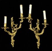 A pair of Louis XV style gilt bronze twin branch rococo wall lights, 23in.