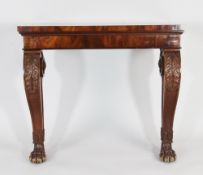 A 19th century mahogany rectangular console table, with scroll legs and paw feet, with stiff leaf