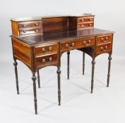 An Edwardian Waring & Gillows rosewood bonheur du jour, the raised superstructure with four