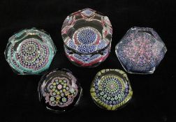 Five Whitefriars faceted glass millefleur paperweights, with garland and close packed complex cane