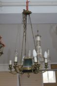 An Empire style six branch chandelier, with scrolling branches and pineapple finial, W.1ft 6in. Drop