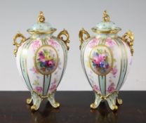 A pair of Royal Crown Derby Sevres style oviform vases and covers, c.1907, each painted with an oval