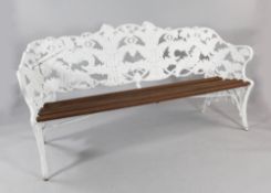 A 19th century white painted cast iron garden bench, decorated with fern leaves and flowerheads,