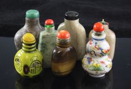 Seven Chinese snuff bottles, in six different materials: grey jade, green and white jadeite, marble,