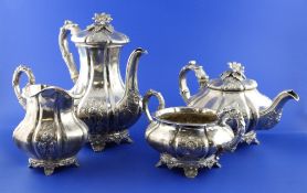 A William IV silver four piece tea and coffee service, of fluted pear form, with embossed floral