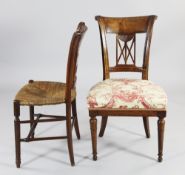 A late 18th century French Directoire chair with pierced back and overstuffed seat on tapering