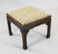 A Chinese rosewood rectangular stool, with traditional carved decoration, pierced key corner