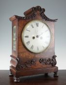 A William IV mahogany bracket clock, with floral carved case, painted Roman dial and unsigned twin