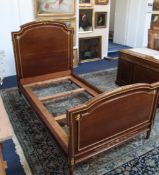 A French Empire style mahogany and ormolu mounted single bed, fits a 6ft x 3ft 8in. mattress
