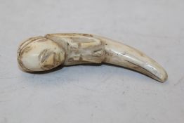 An Inuit seal`s tooth carving 3.25in.