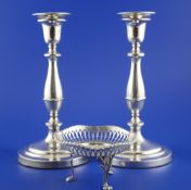 A pair of 1940`s silver candlesticks, of waisted form, Israel Freeman & Son Ltd, London, 1946, 10.