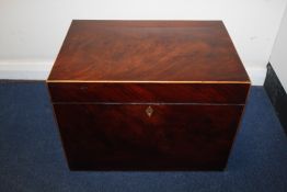 A large 19th century mahogany tea box, with partitioned interior, tinned liner and strainer, with