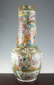 A large Chinese Canton decorated famille rose bottle vase, 19th century, typically painted with