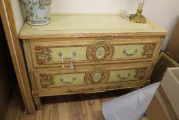 A late 18th century Louis XVI style painted two drawer commode, with floral decoration on tapering