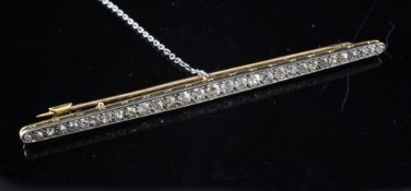 A 1920`s/1930`s gold and platinum diamond bar brooch, set with thirty one graduated old cut