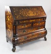 An 18th century Dutch mahogany and marquetry inlaid bombe shaped bureau, the fall front revealing