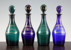 Two pairs of George III Bristol glass spirit decanters and stoppers, c.1810, in blue and green