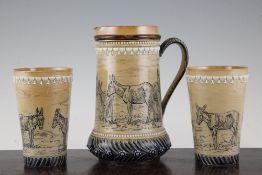 Hannah Barlow for Doulton Lambeth. A `donkey` jug and two beakers, dated 1877, each decorated with a