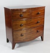 A 19th century mahogany bowfront chest, of two short and two long drawers, with bun handles, on