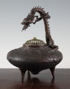A Japanese bronze koro, 19th century, of compressed globular form cast in relief with scrolling