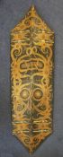 A Dayak head hunter shield, painted with traditional motifs and tapered ends, 48in.