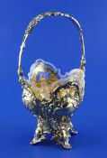 A late 19th century continental pierced repousse silver gilt sugar basket, of vase form, with