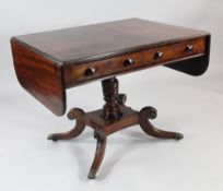 An early 19th century mahogany and rosewood banded pedestal sofa table, with two drawers opposing