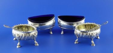 Four George III silver salts, pair of boat shaped with engraved armorial and blue glass liners and