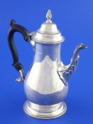 A late Victorian 18th century design bachelor`s silver coffee pot, of baluster form, with acanthus