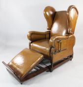 A Victorian Foots patent brown leather and brass studded reclining wing backed reading chair,