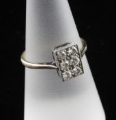 A 1940`s 18ct gold and diamond tablet ring, set with six round cut stones, in Tessiers box, size O.