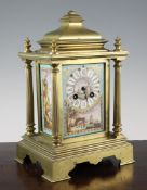 A 19th century French gilt brass and porcelain mantel clock, with jewelled panels decorated with