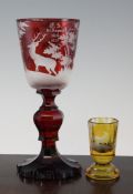 A German wheel engraved goblet and a similar small beaker, late 19th century, the goblet red flashed