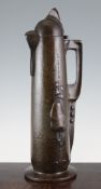 Attributed to Jan Eisenloeffel. A bronzed metal claret jug with planished and stylised fruiting