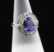 An 18ct white gold, tanzanite and diamond cluster ring, of oval form, the tanzanite weighing