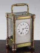 A 19th century French gilt brass hour repeating carriage clock, with enamelled Roman dial set within