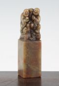 A Chinese soapstone seal, surmounted by the figures of three Luohan, the front with inscription, and