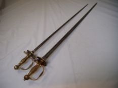 An 18th century French court sword, with rococo cast handle and pommel, the steel blade engraved