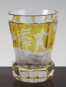A German citrine flashed `bear hunting` glass beaker, mid 19th century, wheel engraved with a