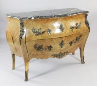 A French Louis XV style marble topped bombe shaped two drawer commode, with ormolu mounts, W.3ft