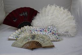 A 19th century French carved ivory fan, with painted leaves and twenty other European fans