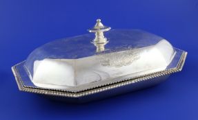 A George III silver octagonal entree dish and cover, with octagonal knop, engraved armorials and