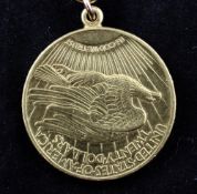 An American 1915 gold 20 dollar coin now mounted on a 14ct gold suspension bale with leather sash