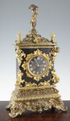 A 19th century French Henri II style ormolu and black marble mantel clock, decorated with a putto