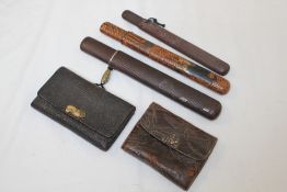Three Japanese Kiseruzutsu (pipe case) and two tobacco pouches, 19th century, the first in lacquer