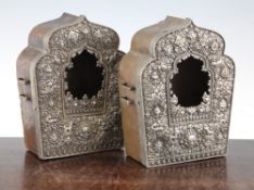 A pair of Tibetan paktong and copper travelling prayer boxes, 19th/20th century, each embossed