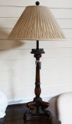 A pair of Regency design mahogany table lamps, with reeded columns, stiff leaf decoration, on