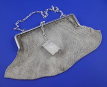 An early 20th century continental silver chain mesh evening handbag with a 1920`s silver compact