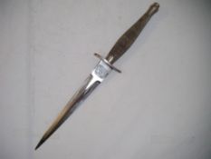 A WWII Fairbairn Sykes commando fighting knife, with Wilkinsons blade, crosshatched handle and brown